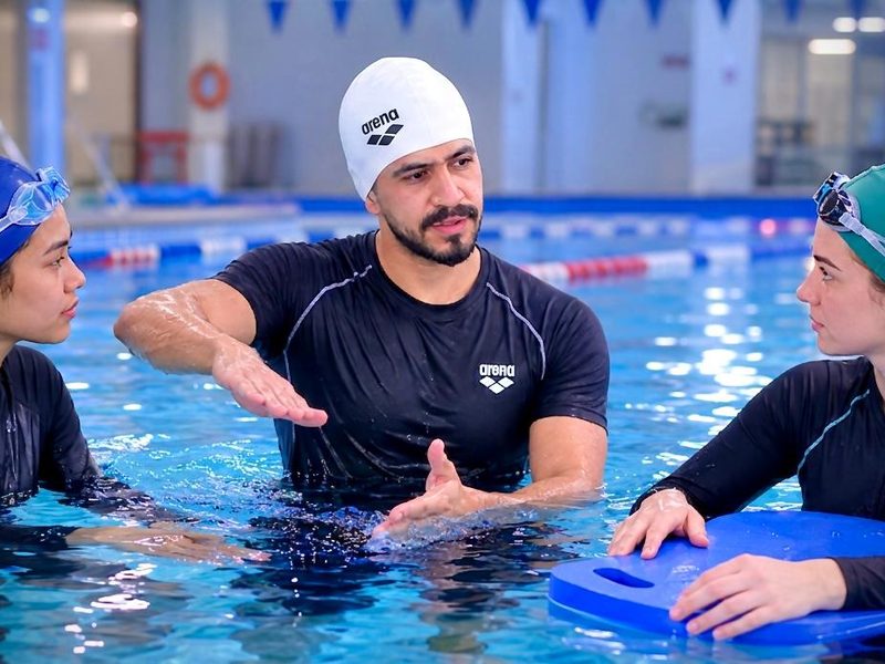 Couple swimming lesson